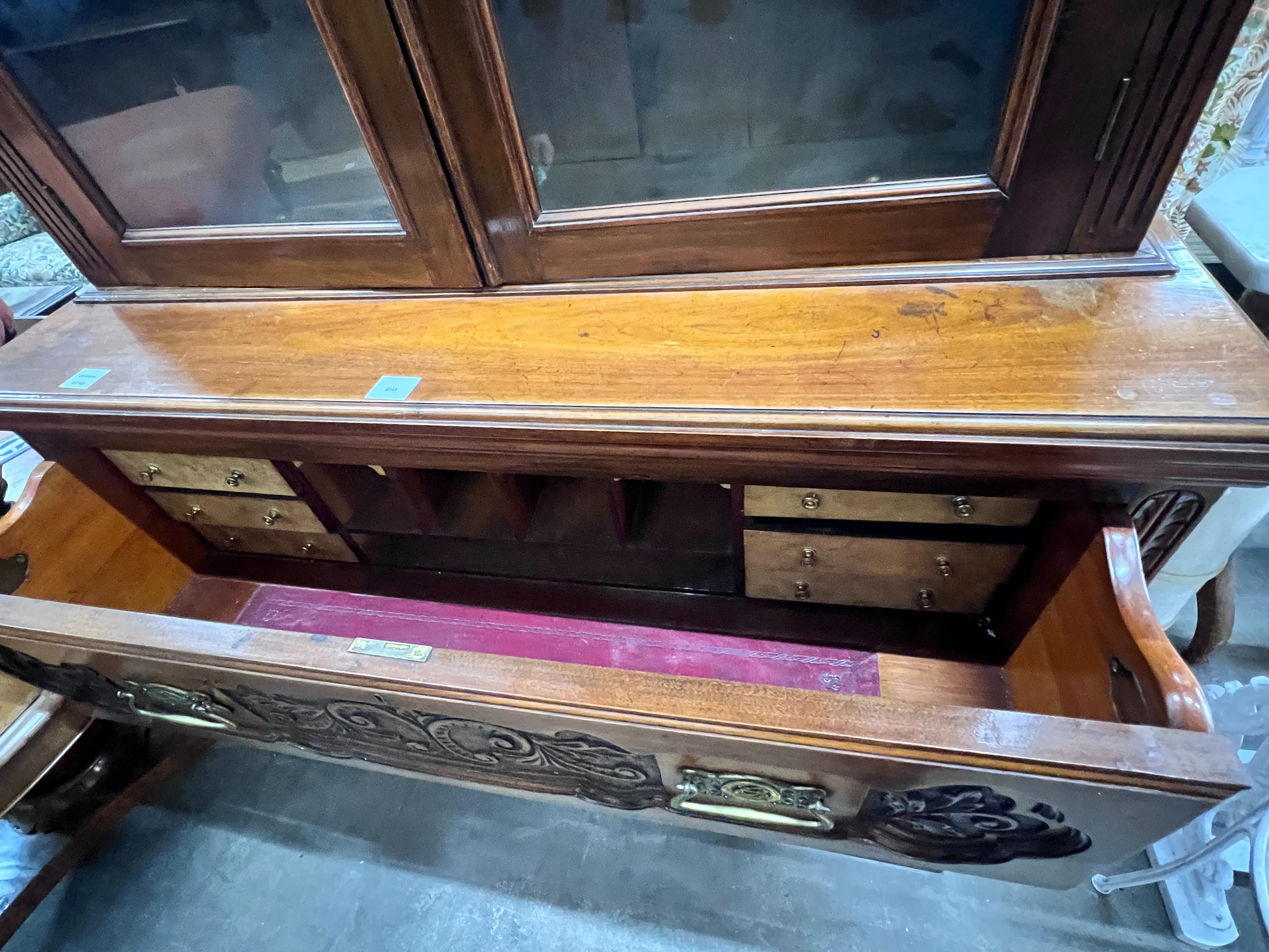 A late Victorian carved walnut secretaire bookcase, width 123cm, depth 48cm, height 234cm
